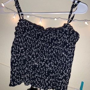 Blue tank top with white flowers.